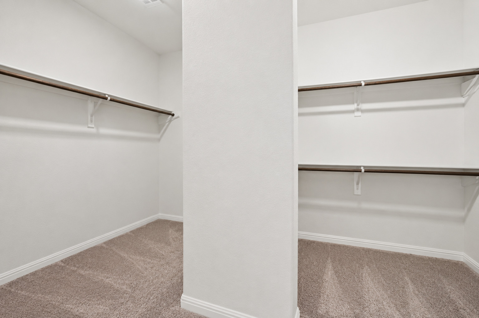 100 Panico Road Hutto, TX 78634 - Photo 26 of 28 Ample hanging space and shelving create an organized wardrobe in this generously proportioned closet.