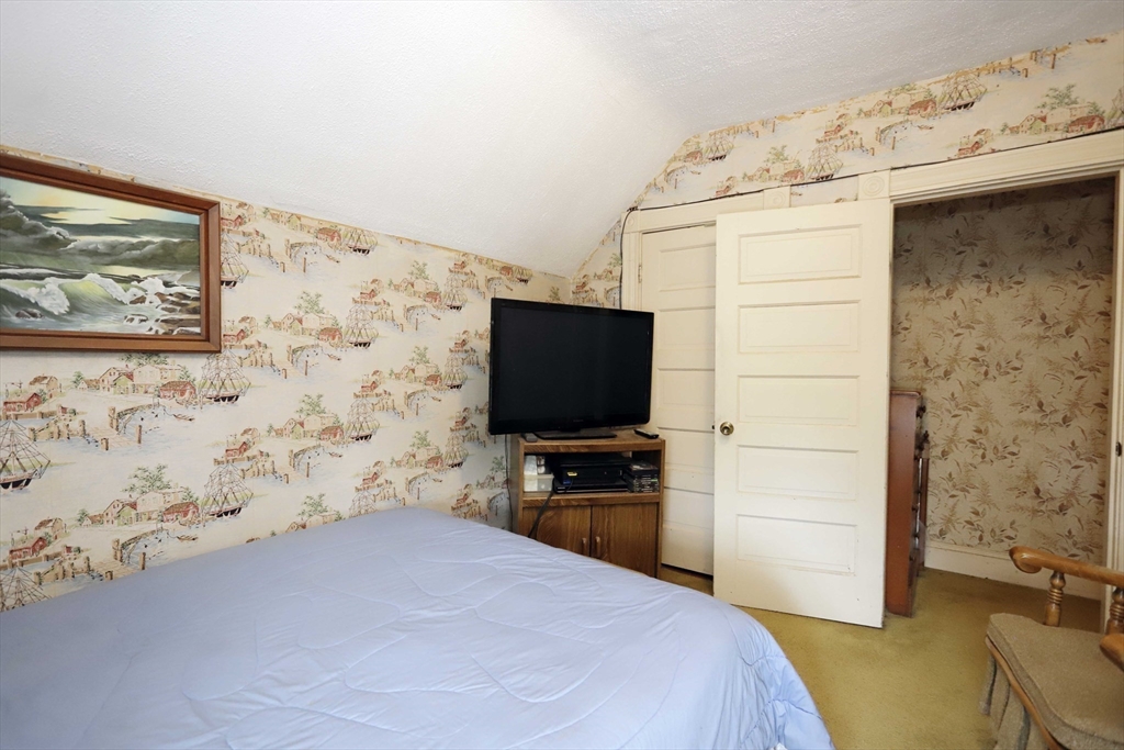 5 Anthony Street Acushnet, MA 02743 - Photo 29 of 37 a bedroom with a bed and a flat screen tv