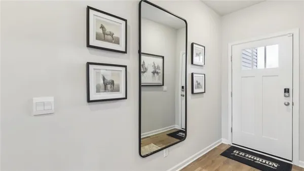 a view of a hallway with paintings on the wall