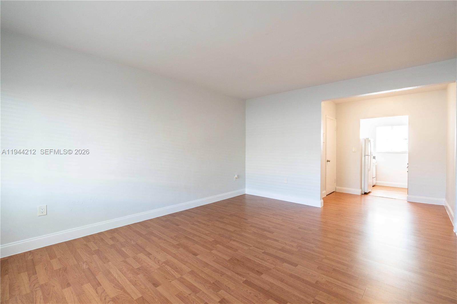 7315 Harding Avenue, Unit 16 Miami Beach, FL 33141 - Photo 3 of 13 a view of an empty room and wooden floor