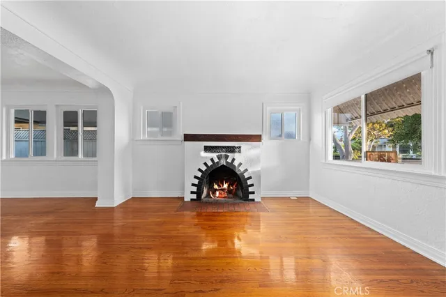 a bedroom with a bed and a fireplace