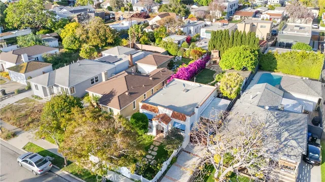 an aerial view of a house with a yard and garden