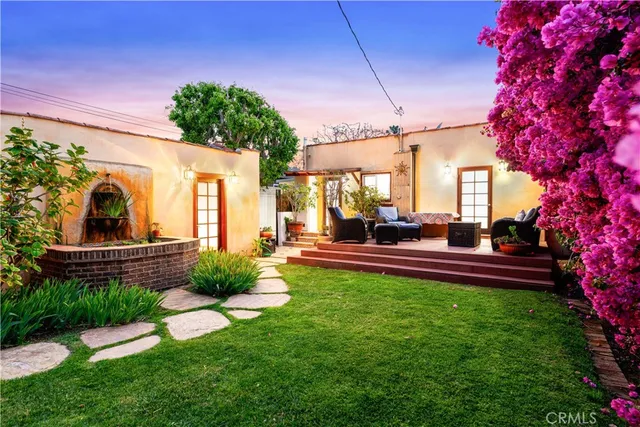 a view of a house with a yard porch and sitting area