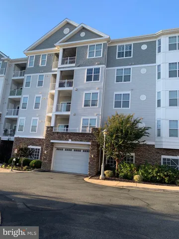 a front view of building with yard