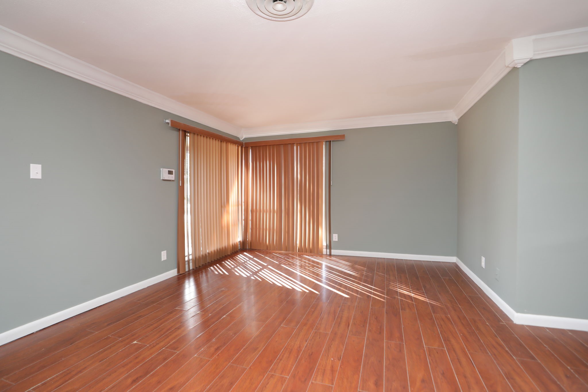 8235 Dover Street Houston, TX 77061 - Photo 7 of 36 a view of an empty room with wooden floor