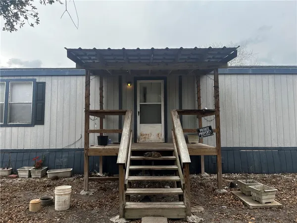 a view of a house with wooden floor and a potted plant