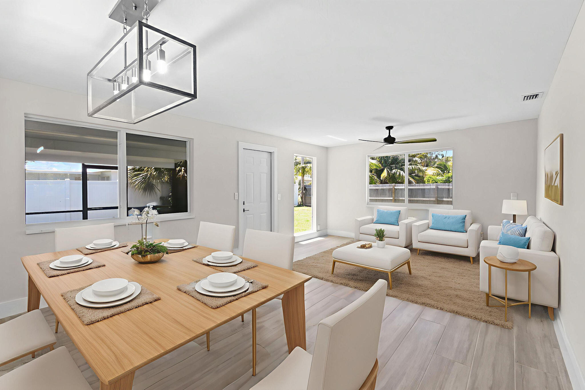1522 Lance Road Jupiter, FL 33469 - Photo 17 of 50 a view of a dining room with furniture a chandelier and wooden floor