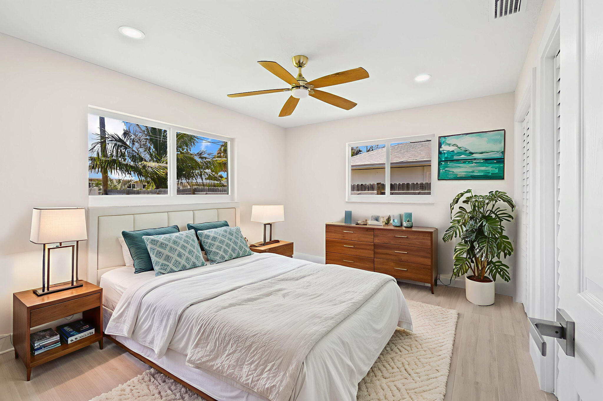 1522 Lance Road Jupiter, FL 33469 - Photo 20 of 50 a bedroom with a balcony a bed and a chandelier
