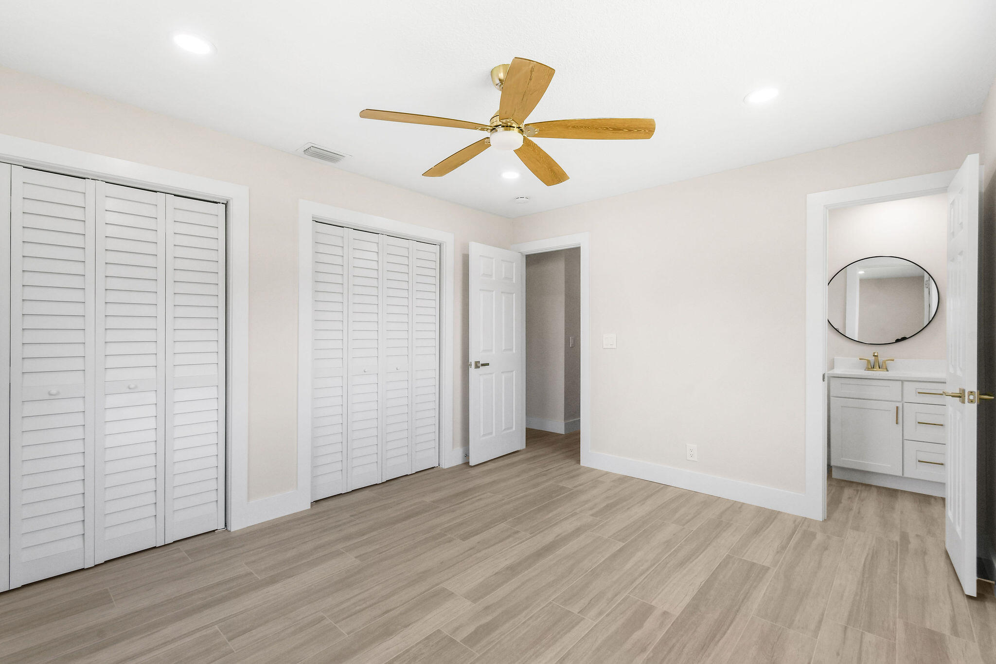 1522 Lance Road Jupiter, FL 33469 - Photo 22 of 50 wooden floor in an empty room with a window
