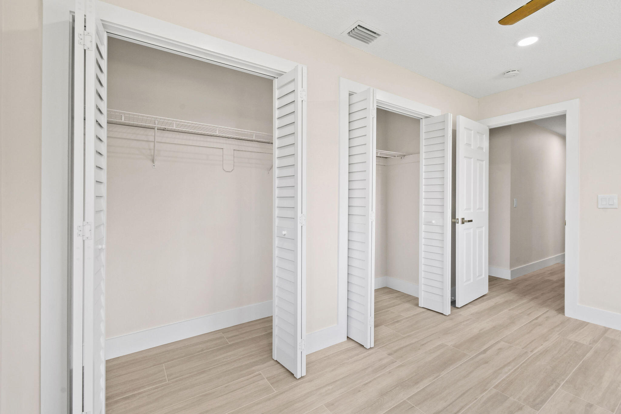 1522 Lance Road Jupiter, FL 33469 - Photo 23 of 50 an empty room with wooden floor & closet area