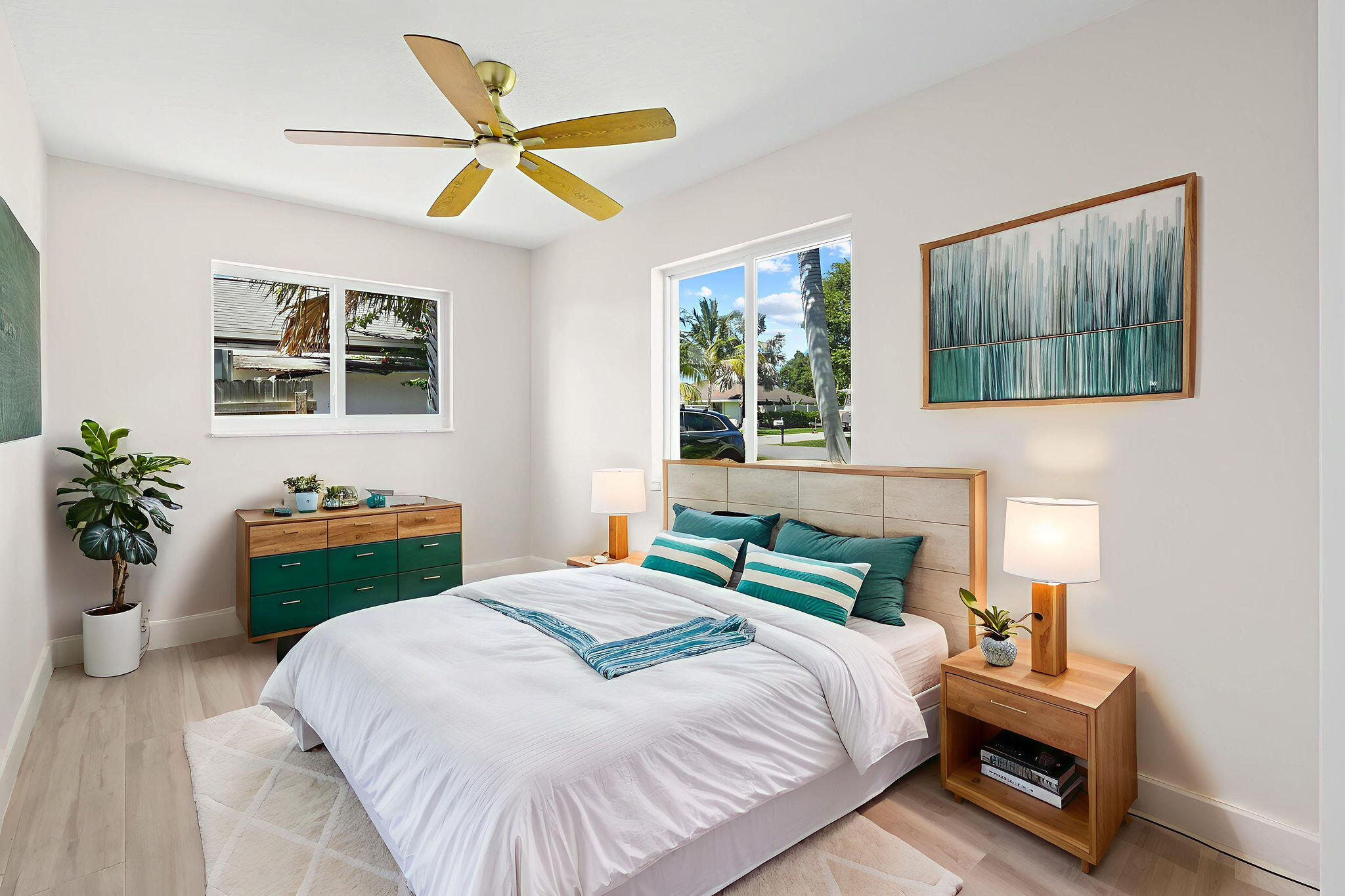 1522 Lance Road Jupiter, FL 33469 - Photo 27 of 50 a bedroom with a bed and a painting on the wall