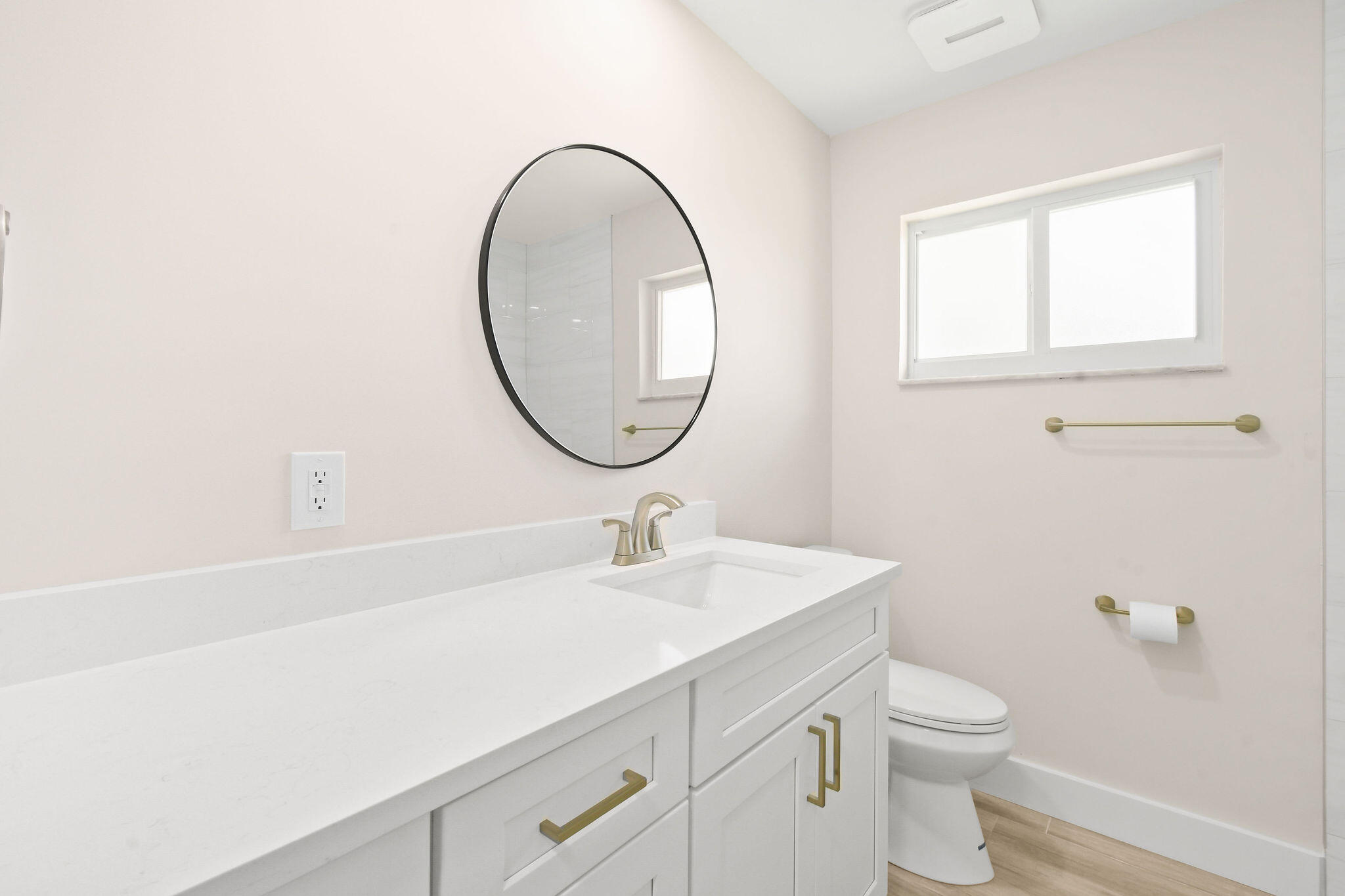 1522 Lance Road Jupiter, FL 33469 - Photo 29 of 50 a bathroom with a sink a toilet and a mirror