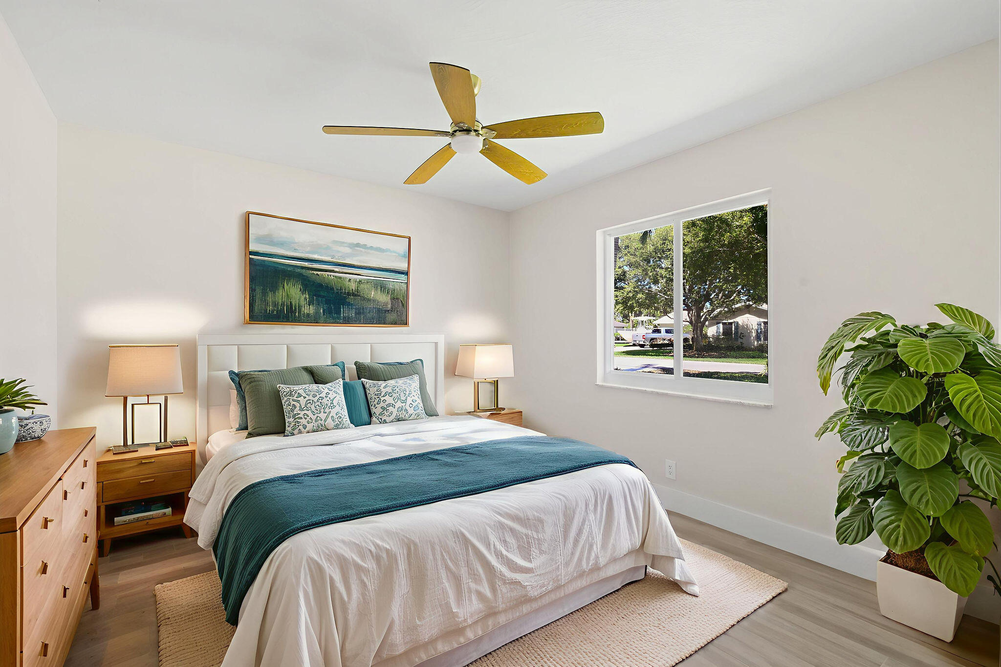 1522 Lance Road Jupiter, FL 33469 - Photo 33 of 50 a bedroom with a bed a chandelier and a window