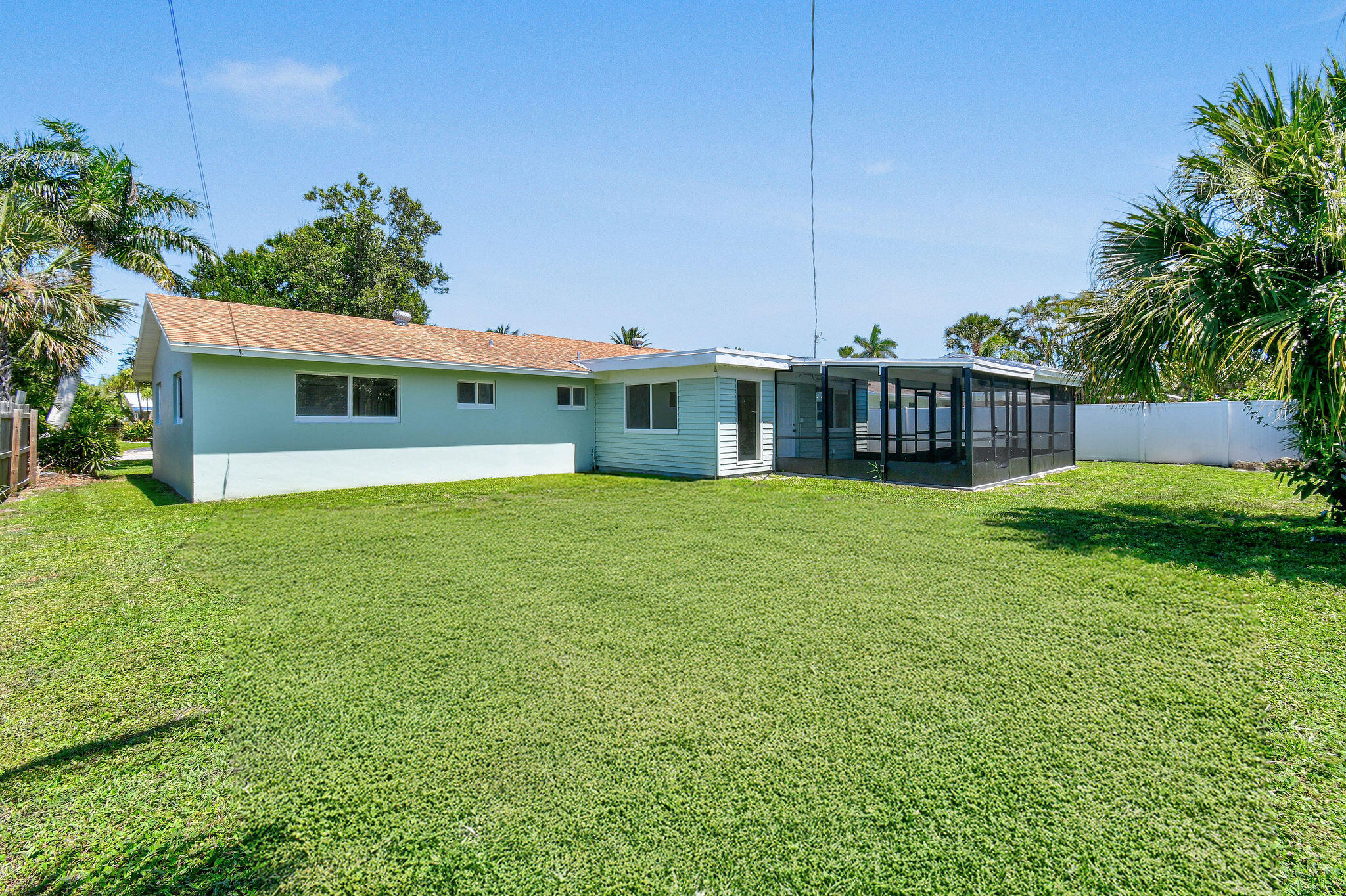 1522 Lance Road Jupiter, FL 33469 - Photo 42 of 50 a view of a house with a yard and a porch