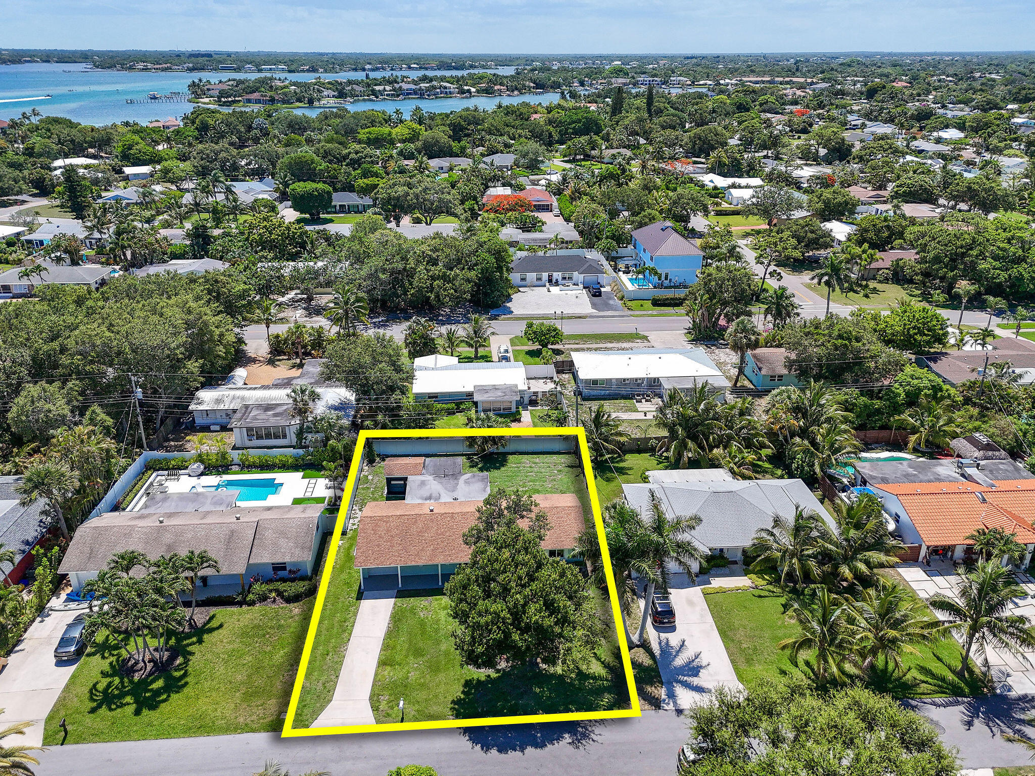 1522 Lance Road Jupiter, FL 33469 - Photo 44 of 50 an aerial view of multiple houses with yard