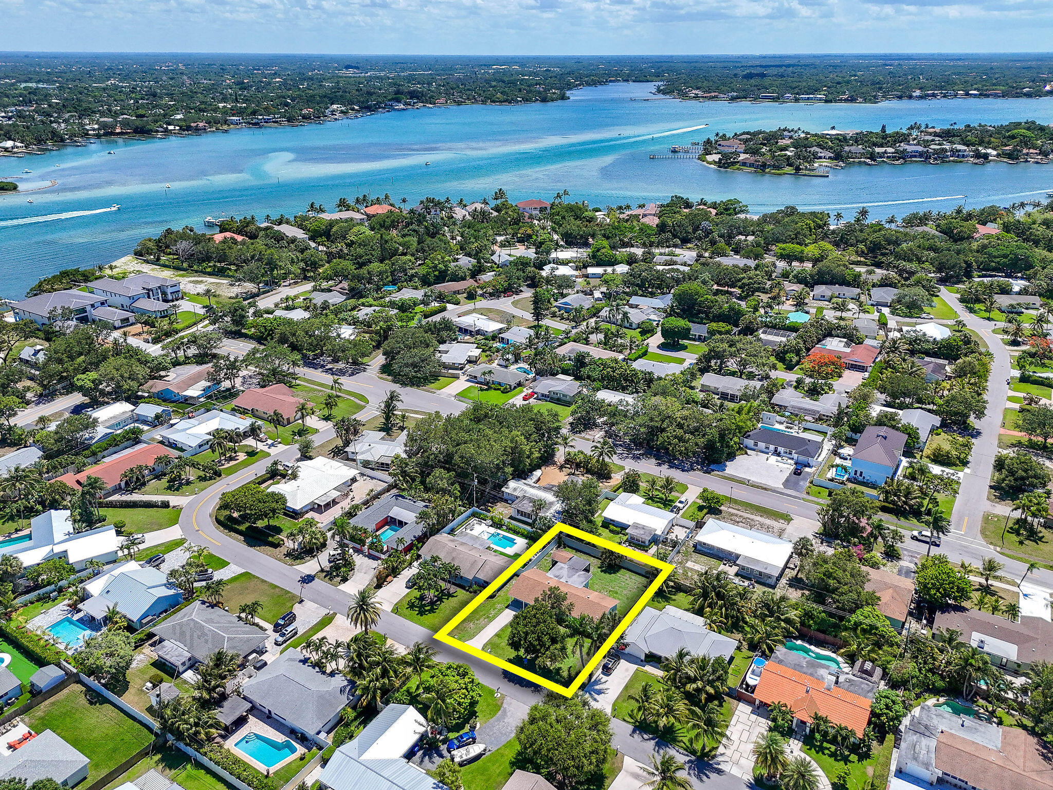 1522 Lance Road Jupiter, FL 33469 - Photo 47 of 50 an aerial view of residential houses with outdoor space and swimming pool
