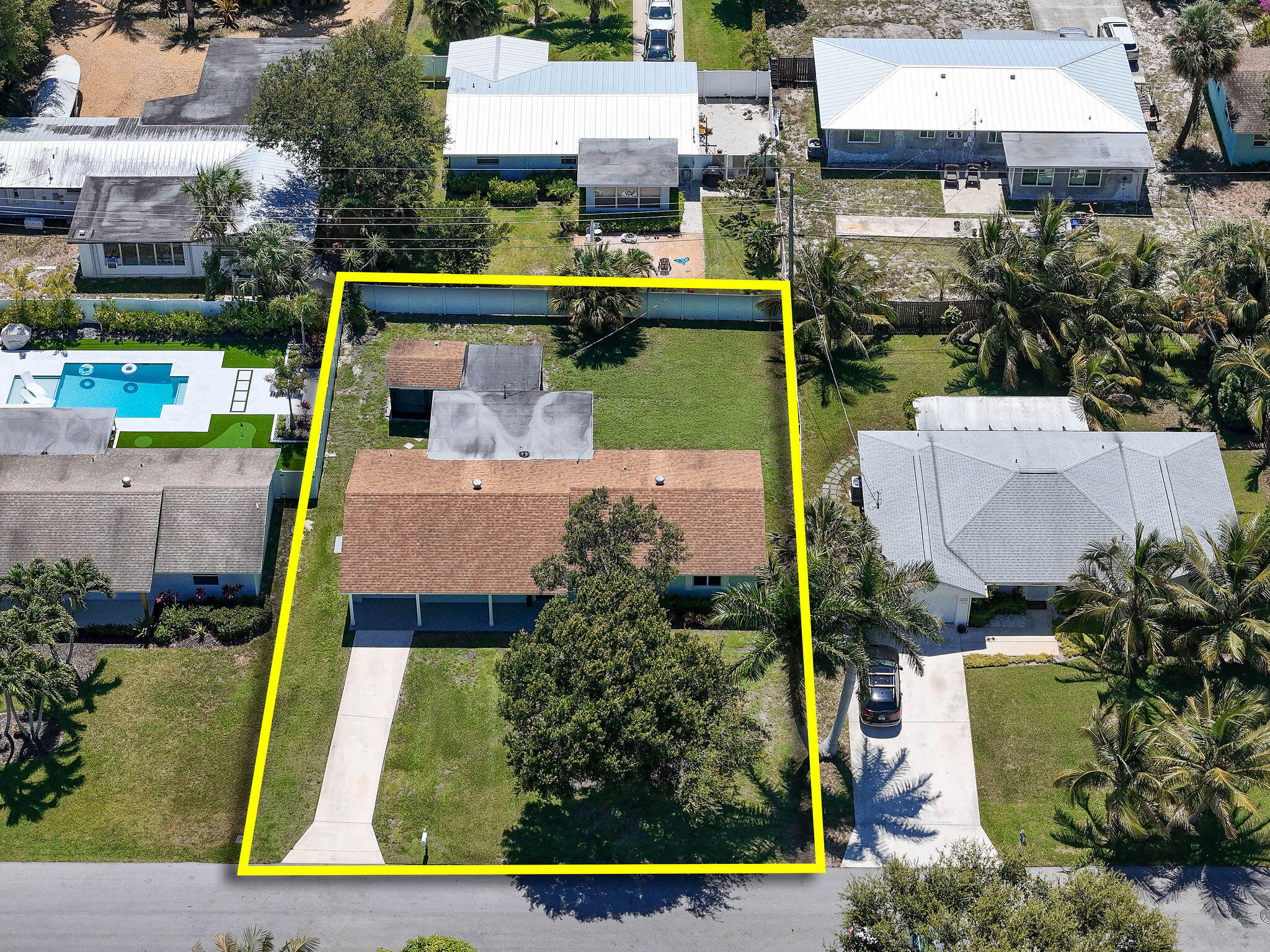 1522 Lance Road Jupiter, FL 33469 - Photo 49 of 50 an aerial view of a house with outdoor space