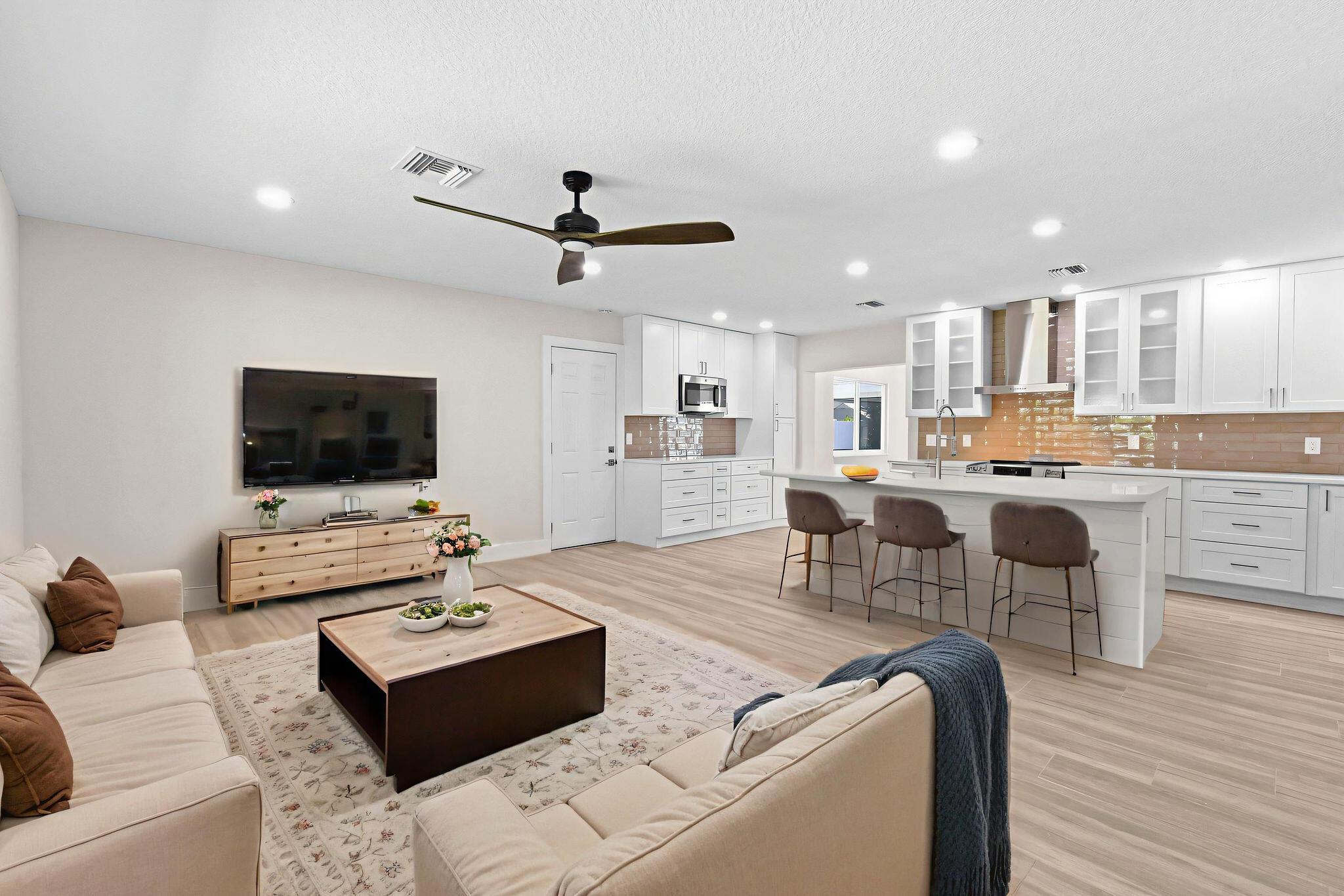 1522 Lance Road Jupiter, FL 33469 - Photo 7 of 50 a living room with furniture and a flat screen tv