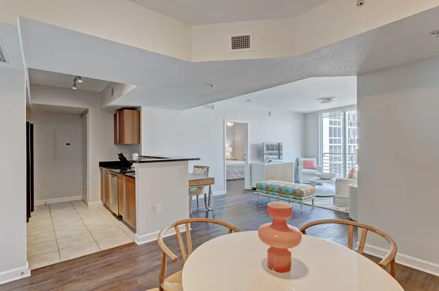 a kitchen with a sink appliances and cabinets