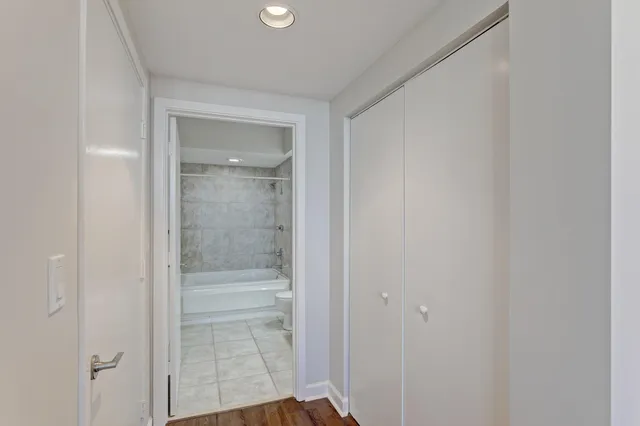 a bathroom with a glass shower door
