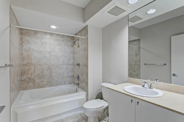 a bathroom with a sink a toilet and a bathtub