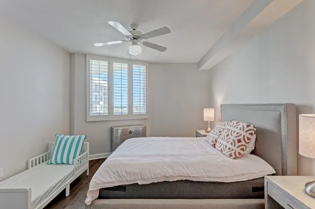 a bedroom with a large bed and a window