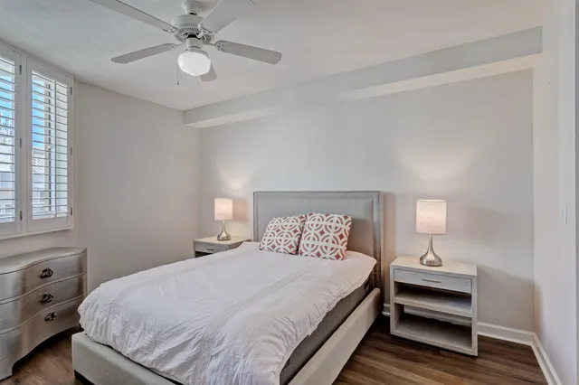 a bedroom with a bed and a lamp