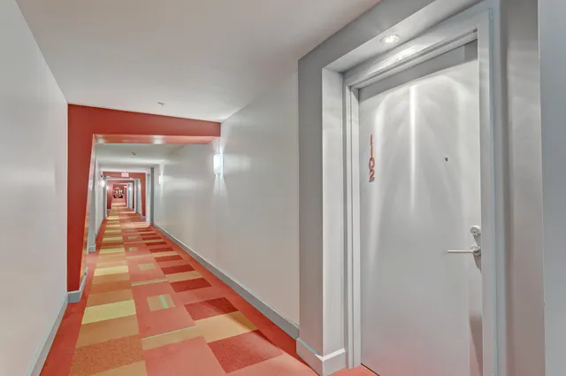 a hallway with mirror and a hallway