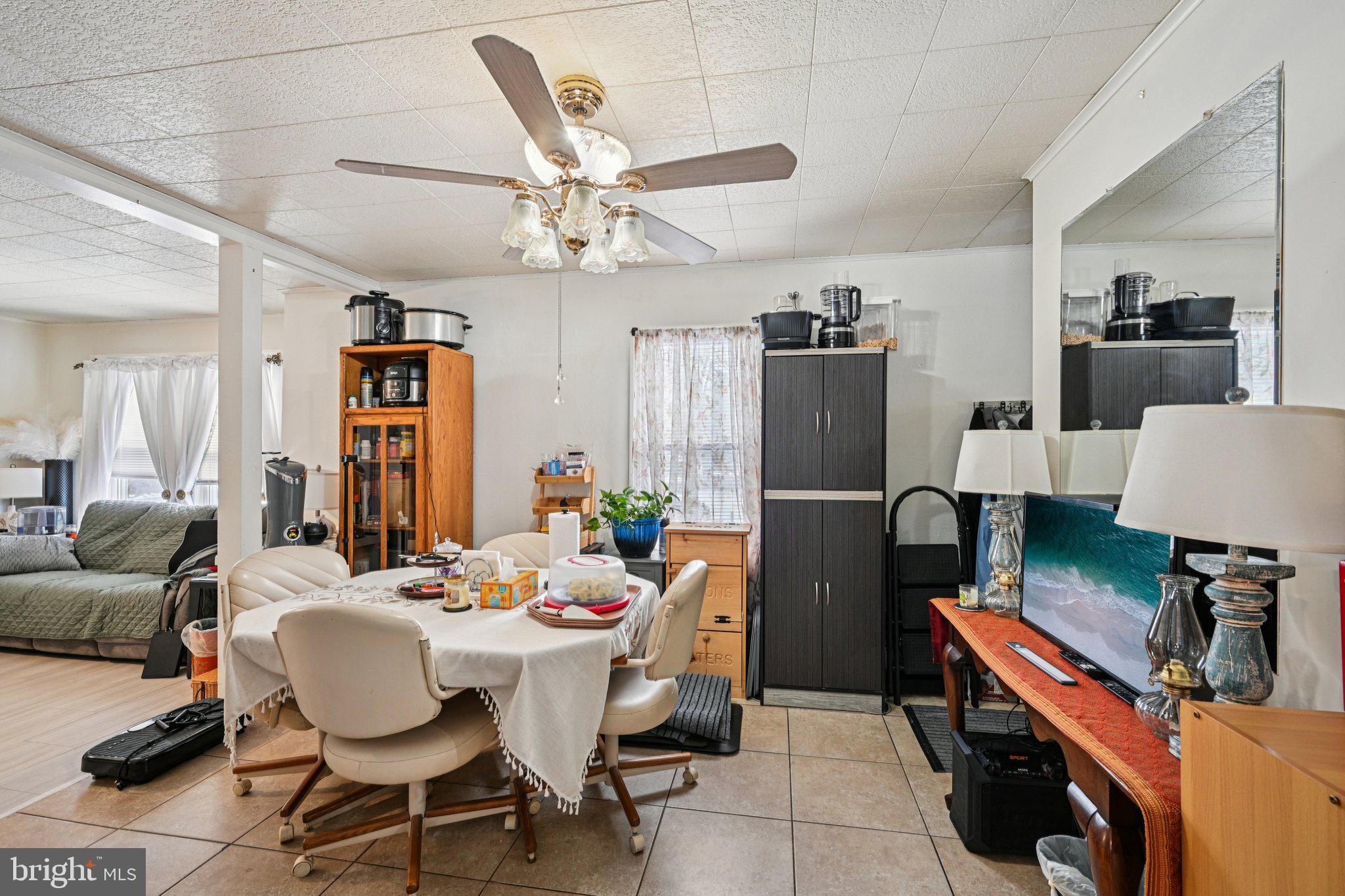 1340 South Orchard Road Vineland, NJ 08360 - Photo 17 of 42 a view of a dining room with furniture and a chandelier