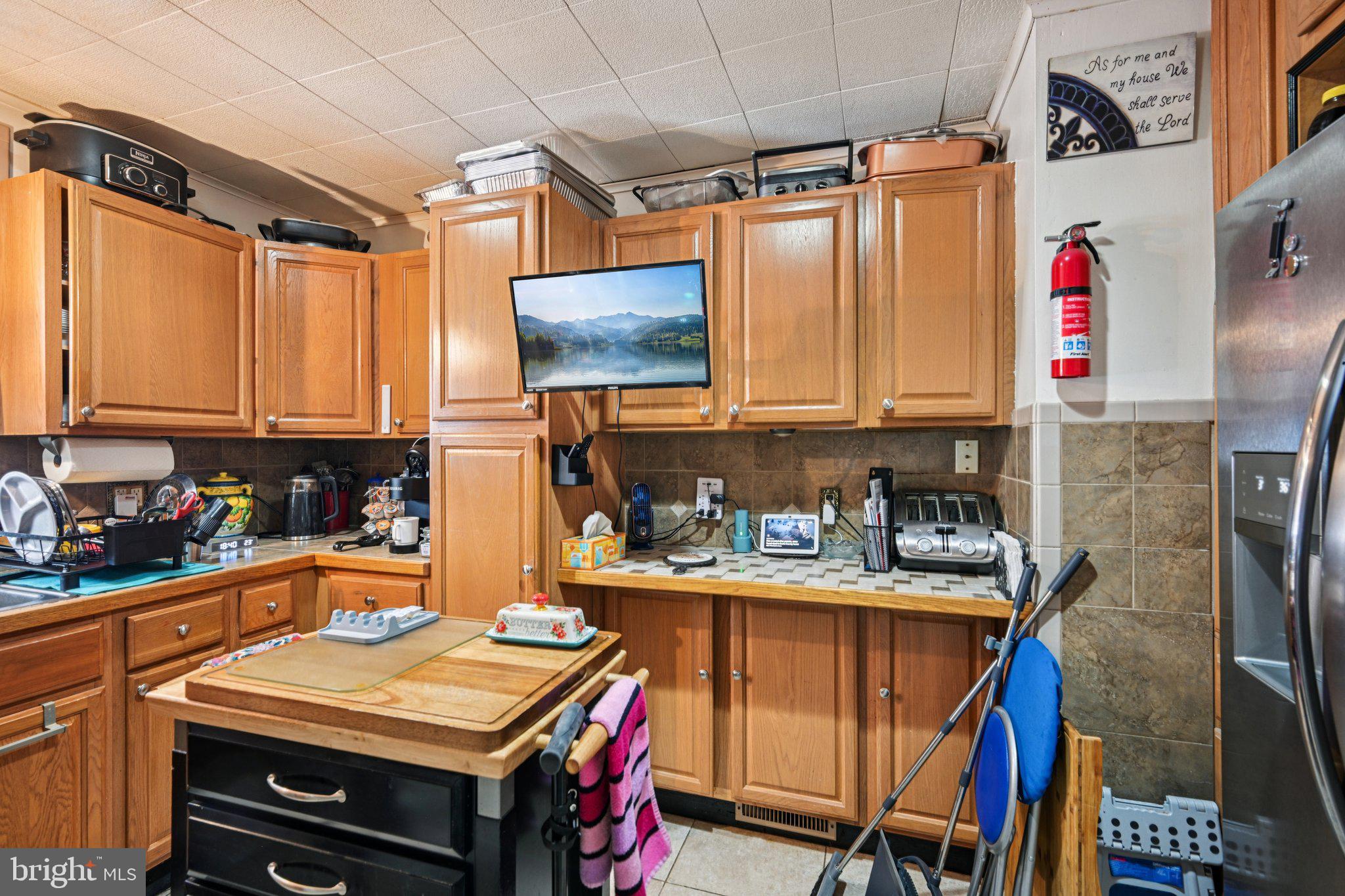 1340 South Orchard Road Vineland, NJ 08360 - Photo 22 of 42 a kitchen with stainless steel appliances kitchen island granite countertop a refrigerator and a stove top oven