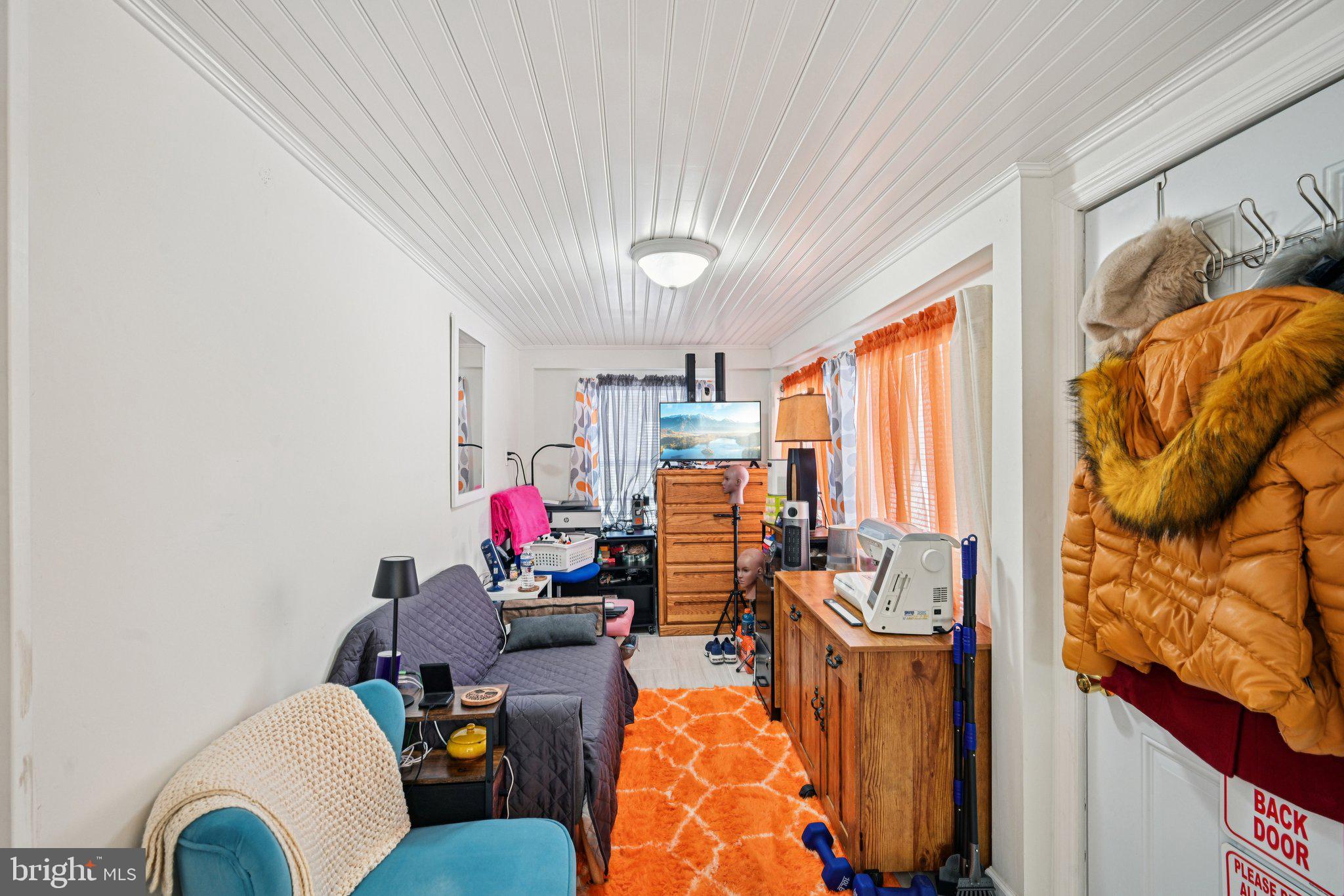 1340 South Orchard Road Vineland, NJ 08360 - Photo 30 of 42 a living room filled with furniture and a chandelier