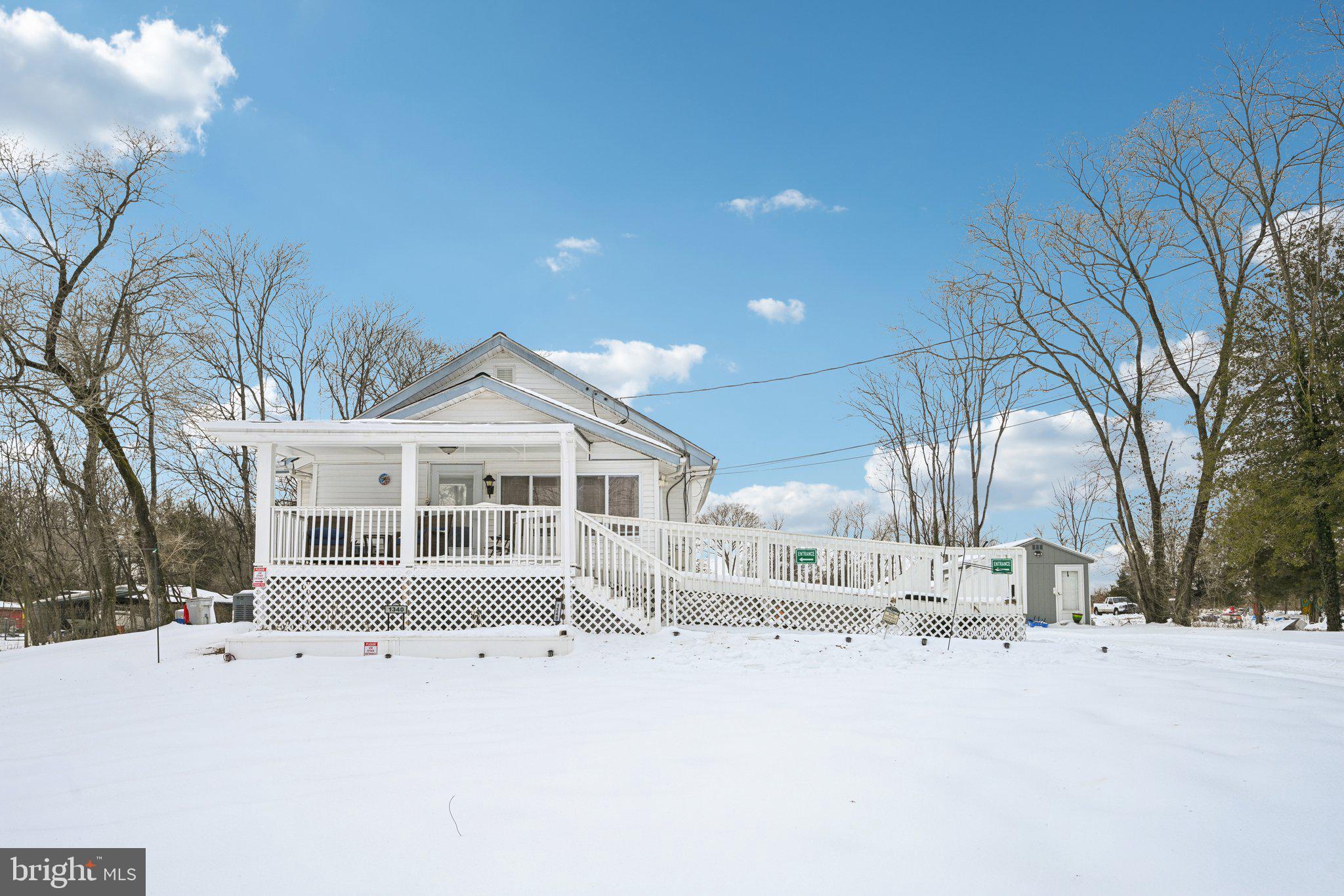 1340 South Orchard Road Vineland, NJ 08360 - Photo 3 of 42 a view of a house with a yard covered in snow