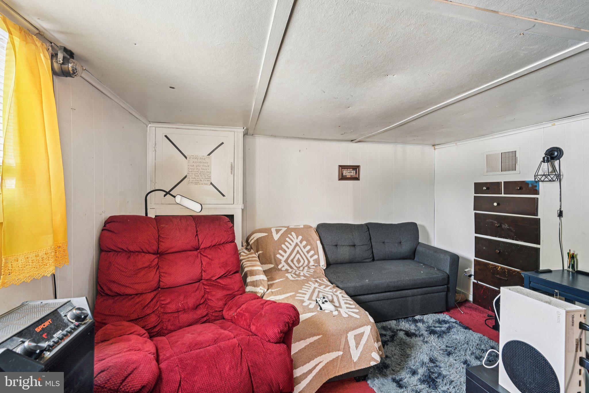 1340 South Orchard Road Vineland, NJ 08360 - Photo 34 of 42 a living room with furniture a flat screen tv and a window