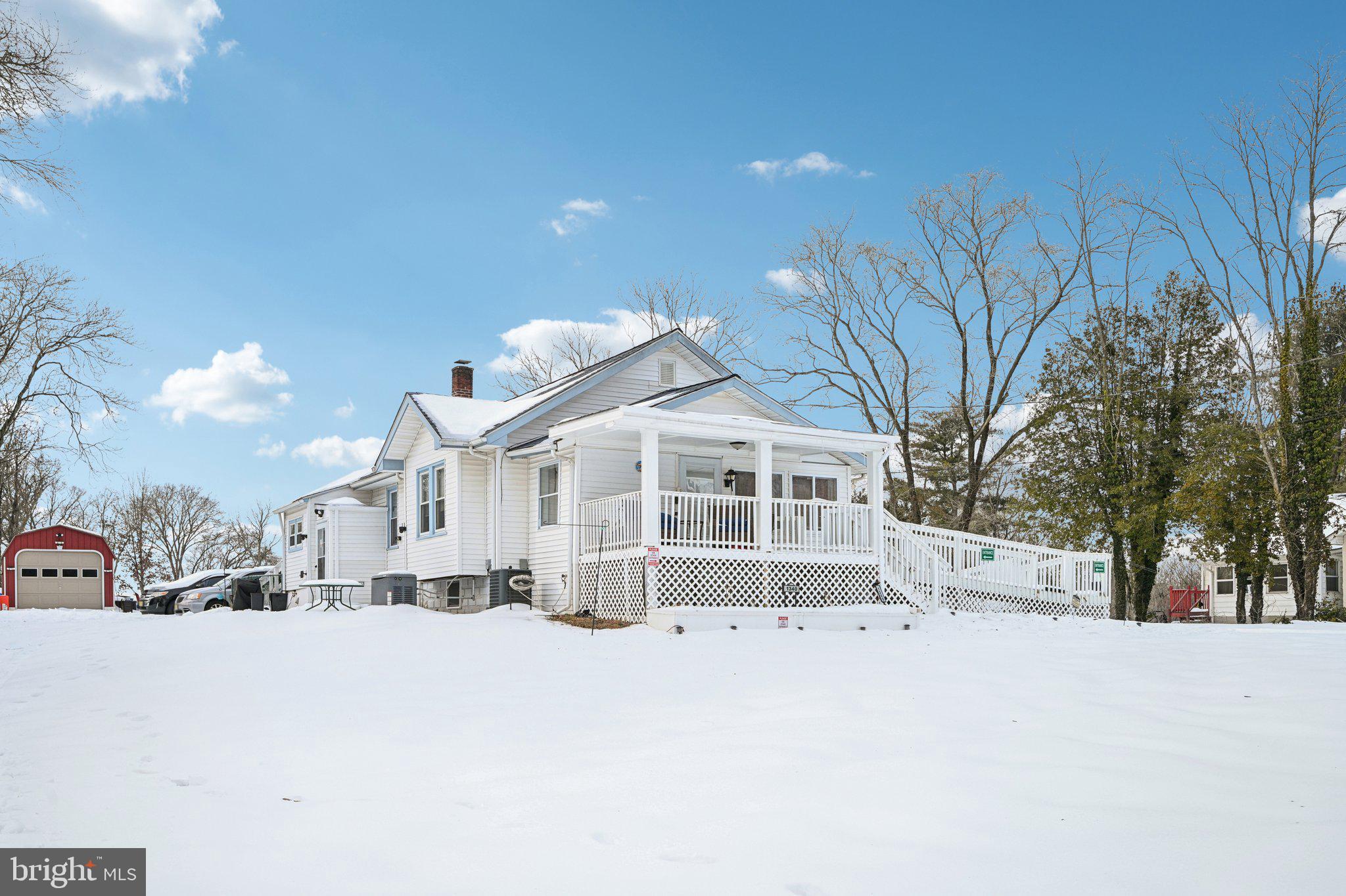 1340 South Orchard Road Vineland, NJ 08360 - Photo 4 of 42 a view of a house with a yard covered in snow