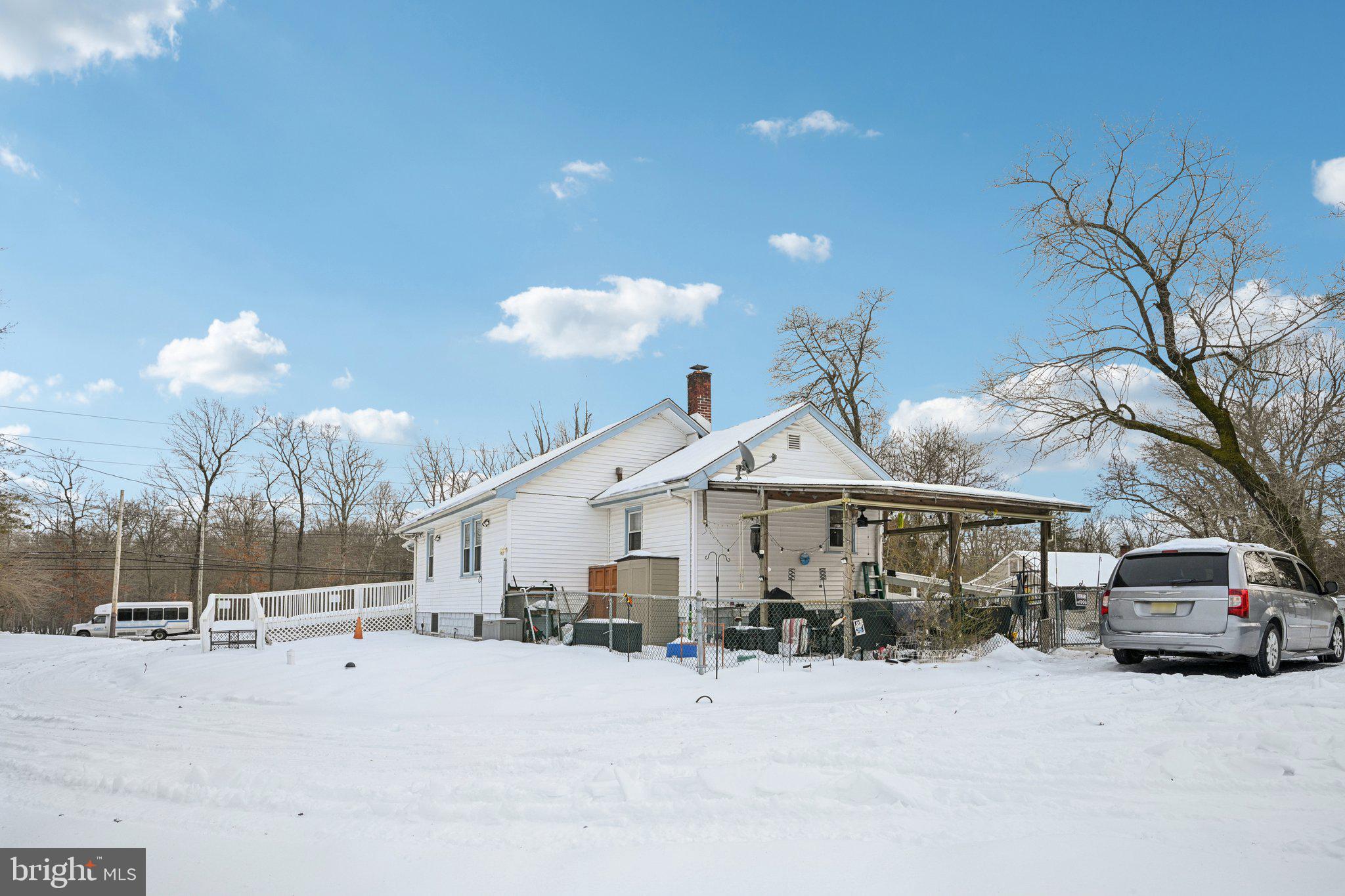 1340 South Orchard Road Vineland, NJ 08360 - Photo 6 of 42 a view of a house with a snow in the yard