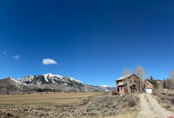 a view of ocean view with a house in the background