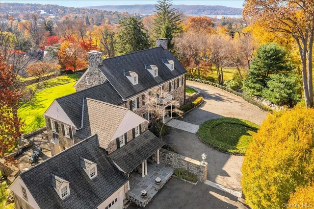 an aerial view of a house with a yard