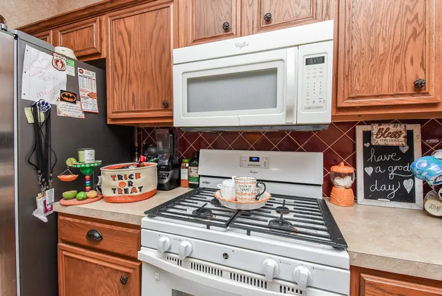 a kitchen with a stove and a microwave