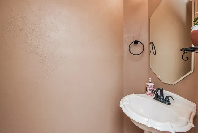 a bathroom with a sink and mirror