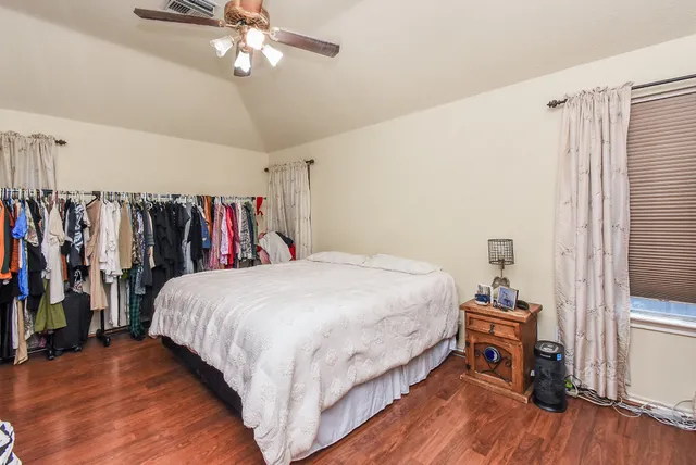 a bed room with a bed and a tv