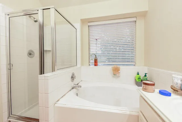 a white bath tub sitting next to a window