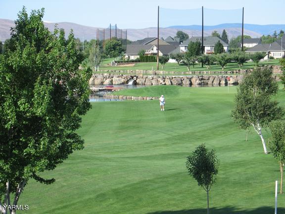 8990 Coolidge Road, Unit 7 Yakima, WA 98903 - Photo 2 of 15 a green field with lots of trees
