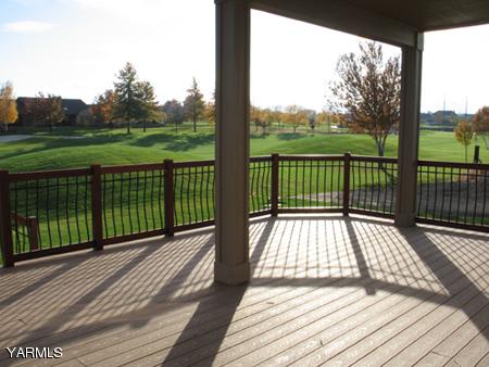 8990 Coolidge Road, Unit 7 Yakima, WA 98903 - Photo 7 of 15 a view of balcony with wooden floor and fence