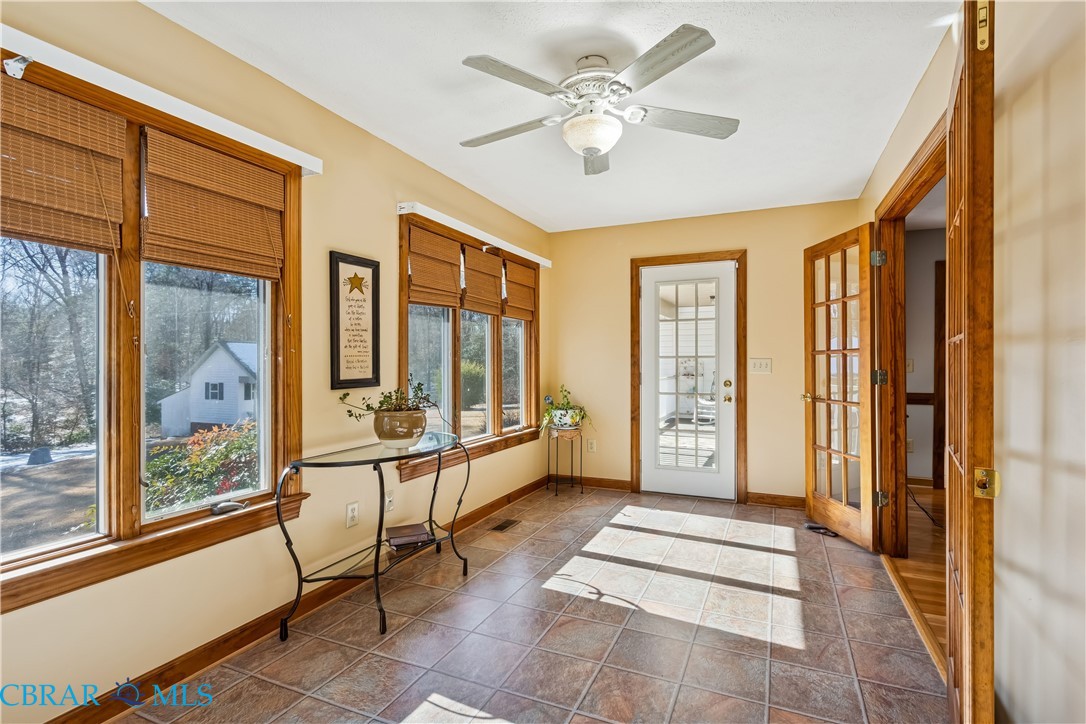 6253 Ark Road Gloucester, VA 23061 - Photo 13 of 38 Doorway featuring ceiling fan and tile patterned floors