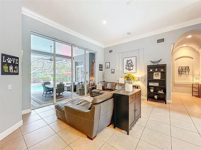 a kitchen with granite countertop a sink a counter top space and living room