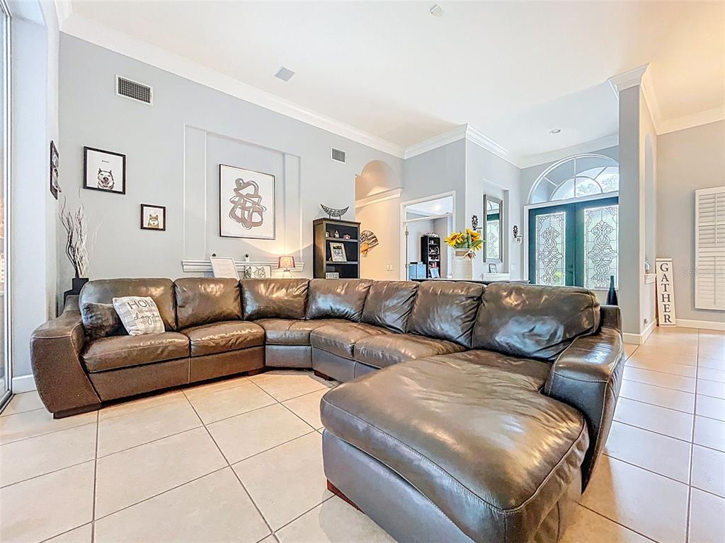 414 Westgate Road Tarpon Springs, FL 34688 - Photo 12 of 75 a living room with furniture and a couch