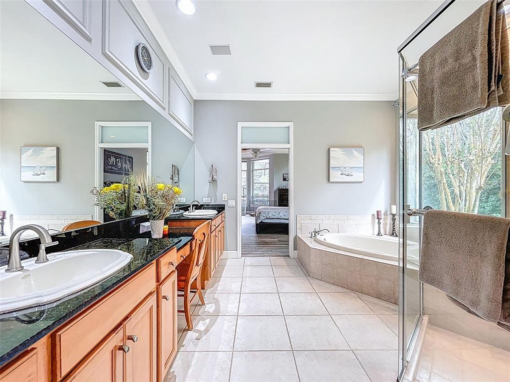 414 Westgate Road Tarpon Springs, FL 34688 - Photo 19 of 75 a kitchen with granite countertop a sink a counter top space and living room