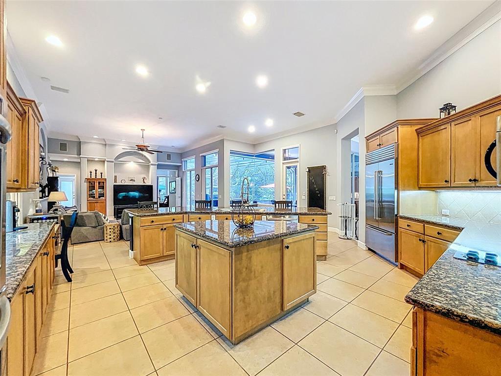 414 Westgate Road Tarpon Springs, FL 34688 - Photo 26 of 75 a kitchen with stainless steel appliances kitchen island granite countertop a sink and cabinets