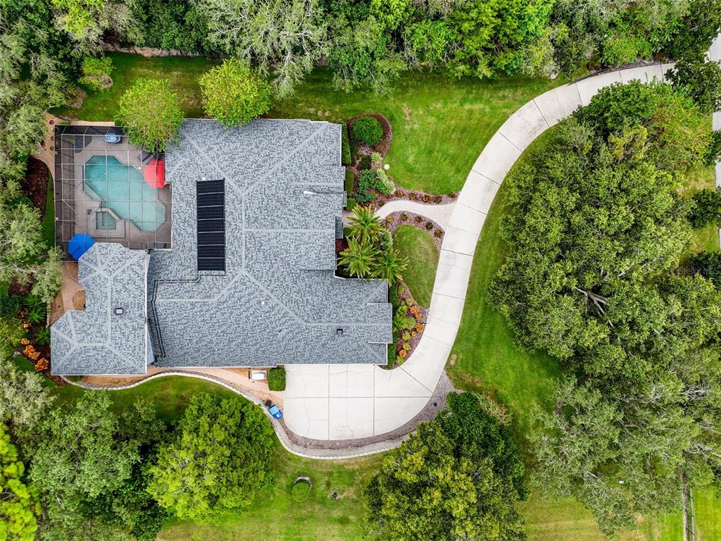 414 Westgate Road Tarpon Springs, FL 34688 - Photo 3 of 75 an aerial view of a house with outdoor space and a lake view