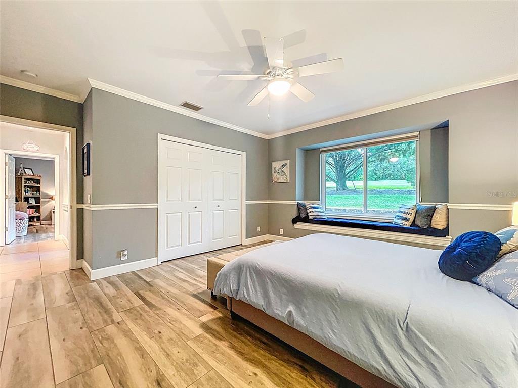 414 Westgate Road Tarpon Springs, FL 34688 - Photo 37 of 75 a bedroom with a large bed and a window